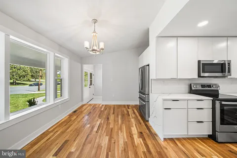 a kitchen with a sink stove and refrigerator