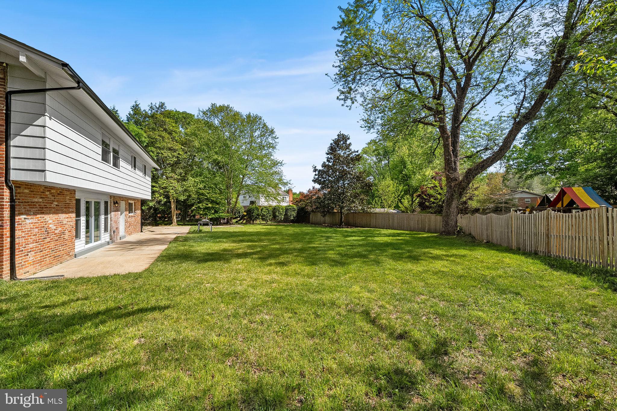 11716 Lovejoy Street Silver Spring, MD 20902 - Photo 8 of 12 a view of house with backyard and trees