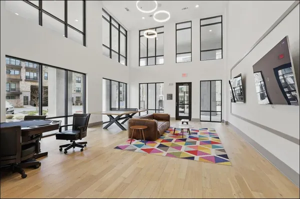 a living room with furniture fireplace and rug floor