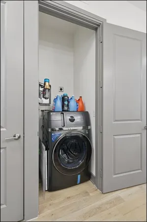 a utility room with sink dryer and washer