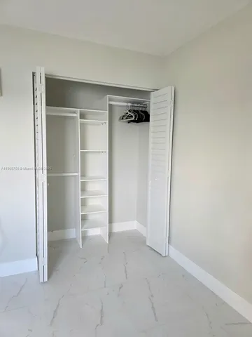 a view of an empty walk in closet