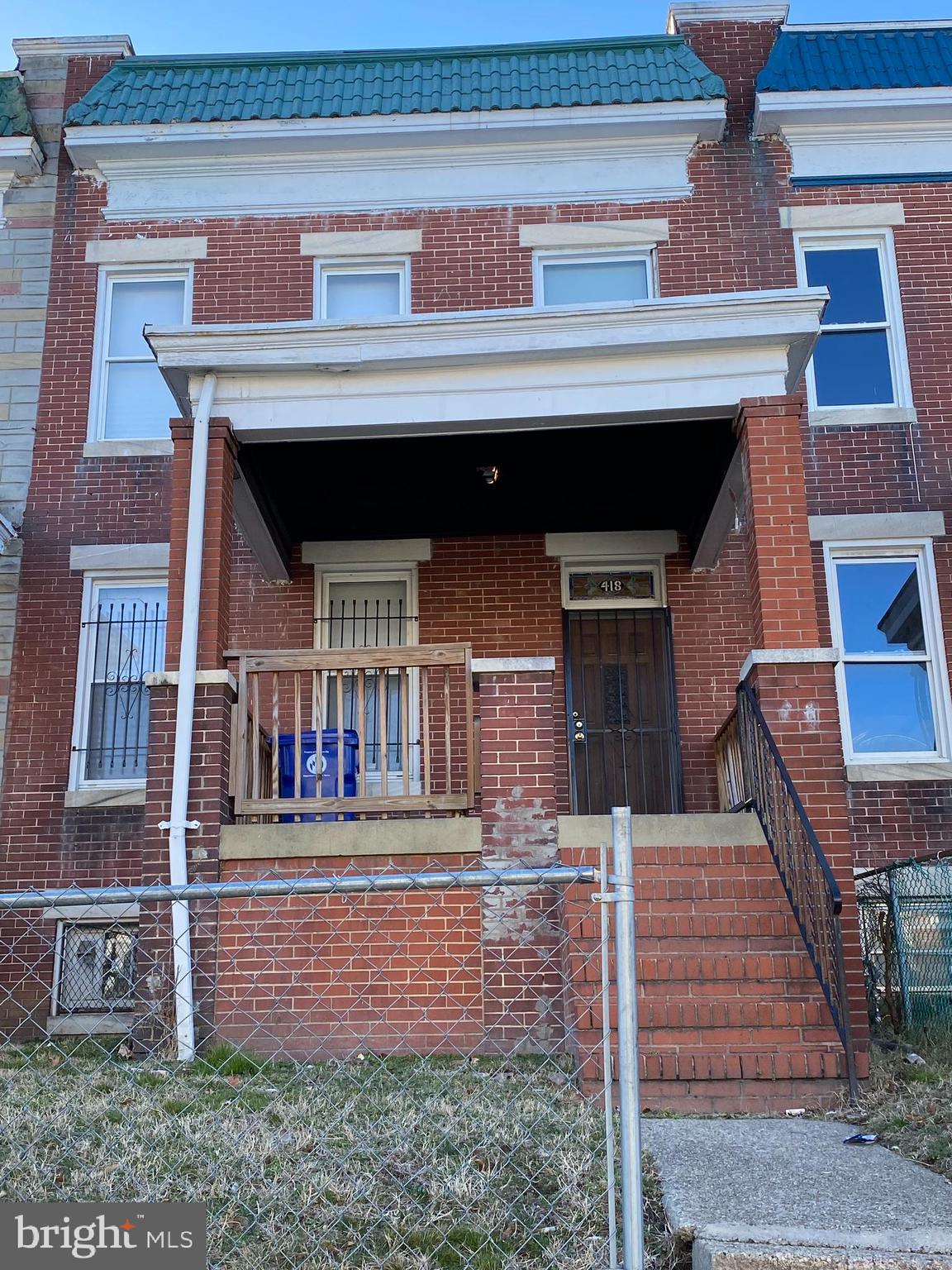 418 Edgewood Street Baltimore, MD 21229 - Photo 1 of 10 a front view of a house with wooden stairs