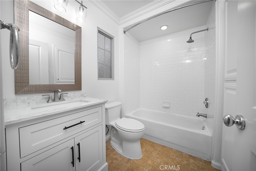 70 Latitude Irvine, CA 92618 - Photo 13 of 27 a bathroom with a granite countertop sink a toilet and a bathtub