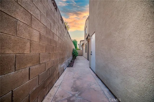 a view of a pathway along a house