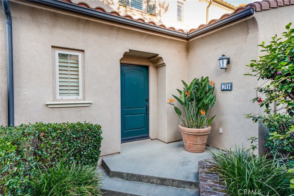 70 Latitude Irvine, CA 92618 - Photo 4 of 27 a potted plant in front of a house