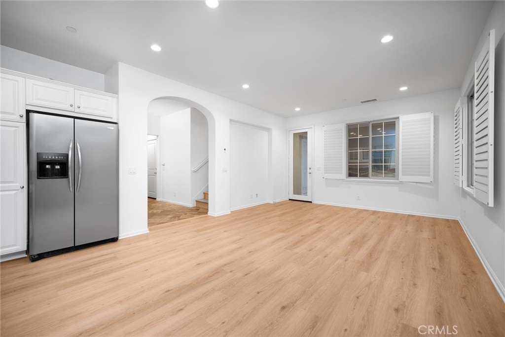 70 Latitude Irvine, CA 92618 - Photo 7 of 27 a view of empty room with wooden floor and window