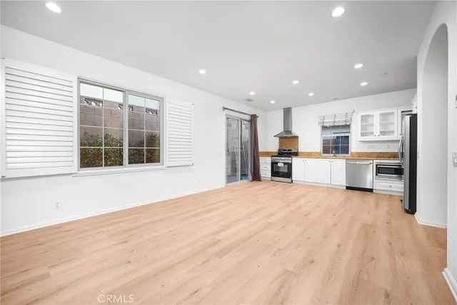 a view of an entryway with wooden floor