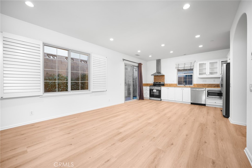 70 Latitude Irvine, CA 92618 - Photo 8 of 27 a view of kitchen with wooden floor and windows