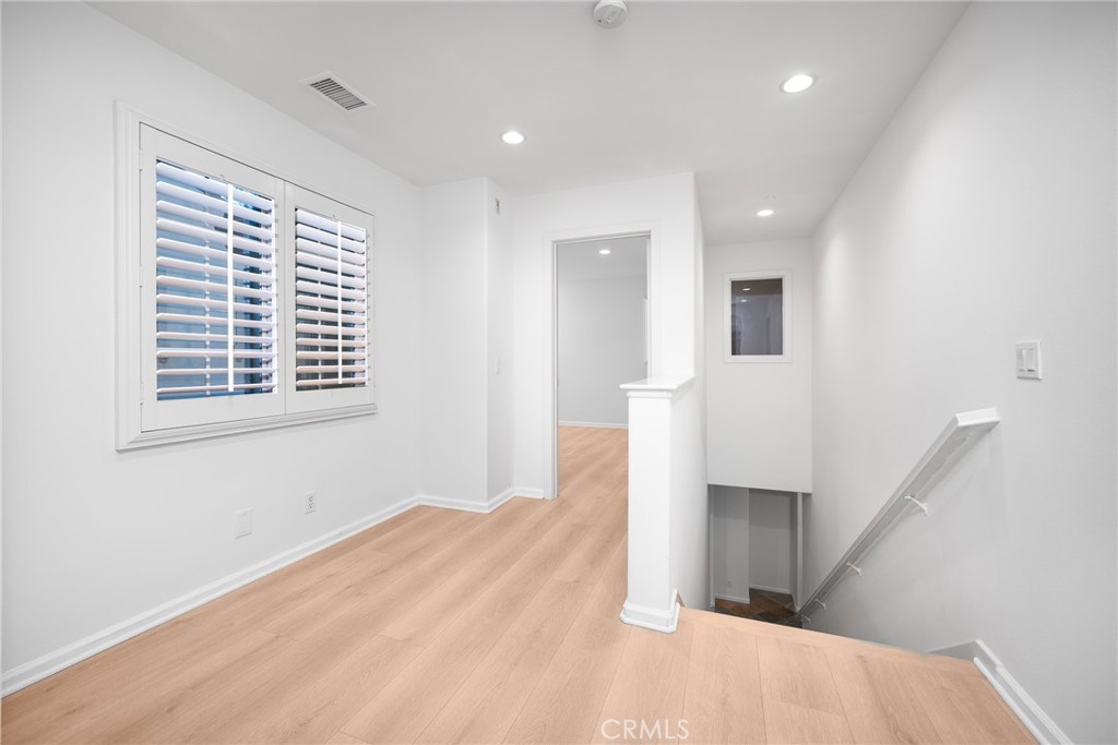 70 Latitude Irvine, CA 92618 - Photo 10 of 27 a view of empty room with wooden floor and fan