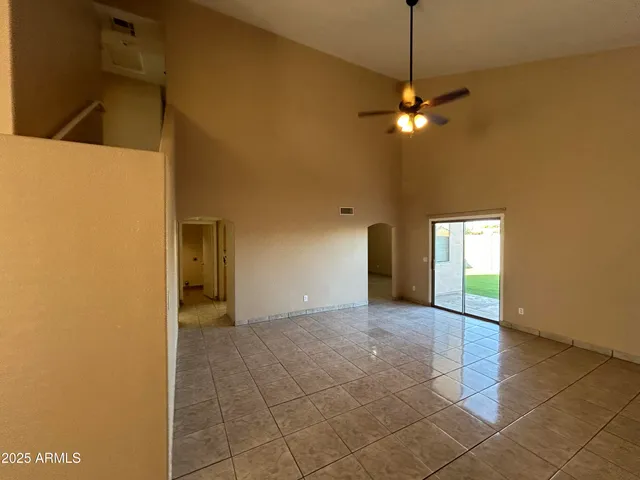 a view of a kitchen with a sink and a chandelier