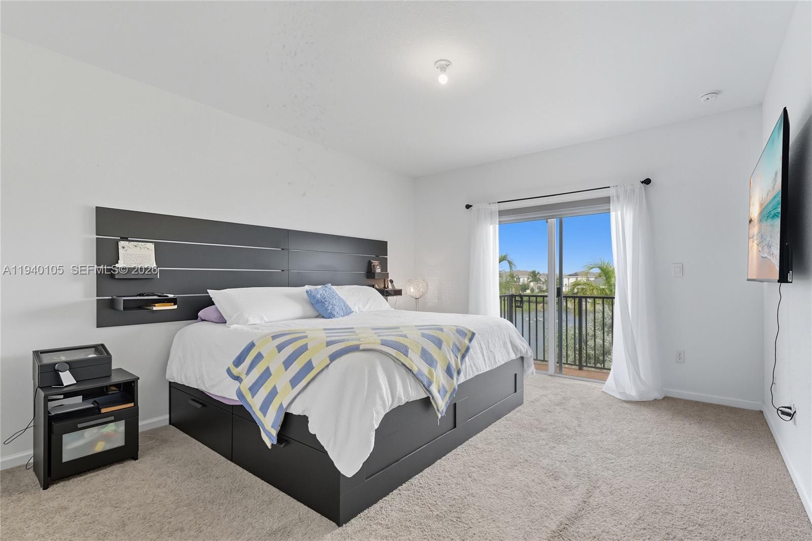 805 South E 18th Street, Unit 805 Homestead, FL 33034 - Photo 14 of 29 a bedroom with a bed and large window