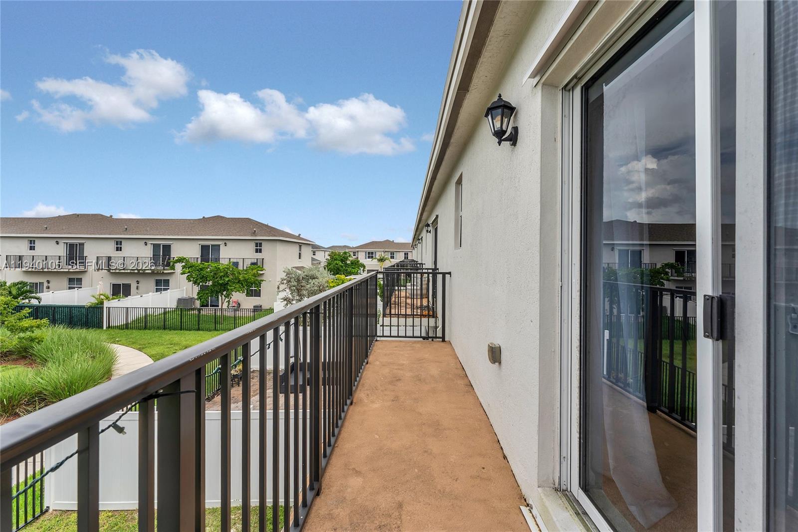 805 South E 18th Street, Unit 805 Homestead, FL 33034 - Photo 15 of 29 a view of a balcony with a porch