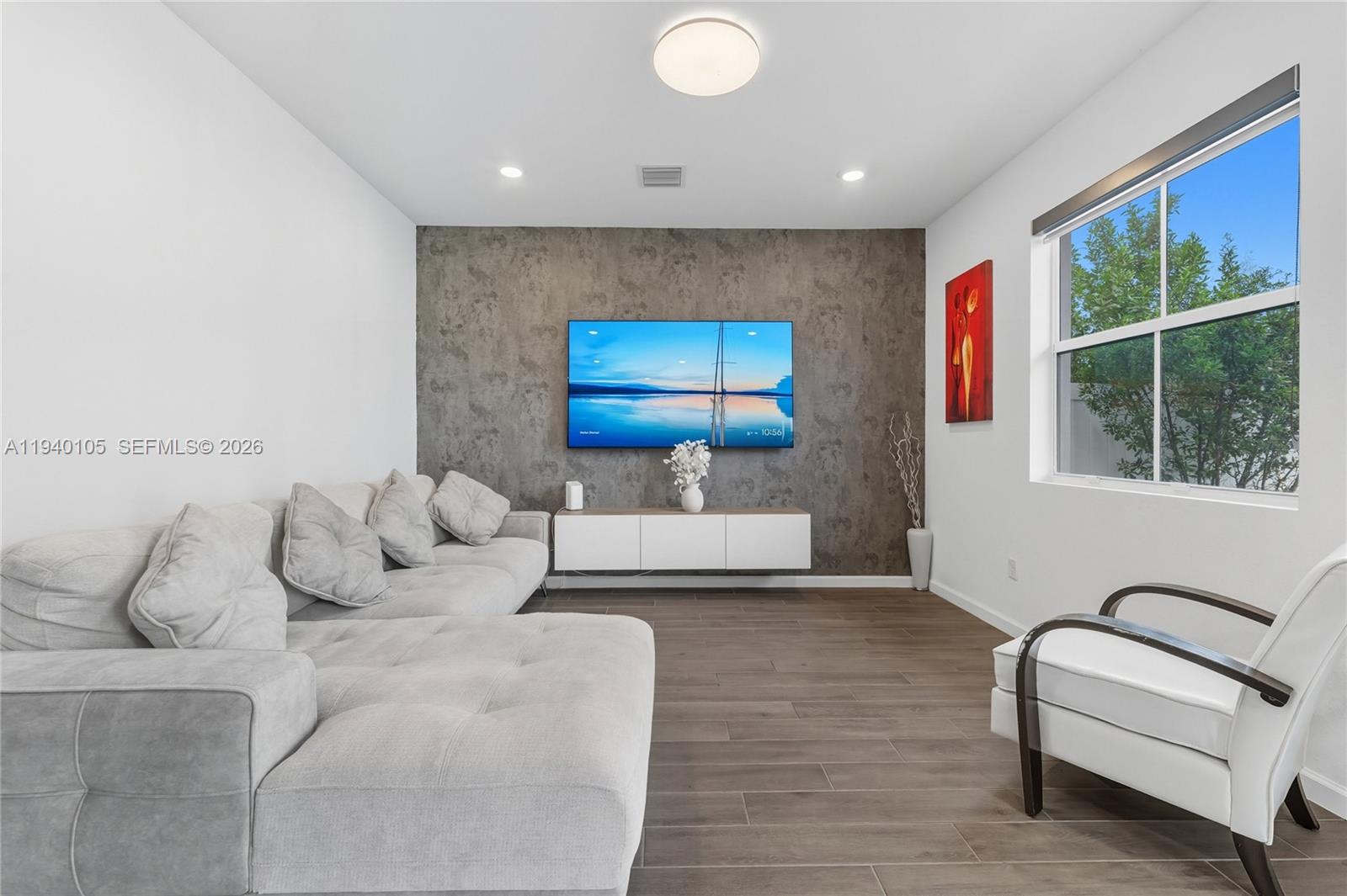 805 South E 18th Street, Unit 805 Homestead, FL 33034 - Photo 8 of 29 a living room with furniture and a large window