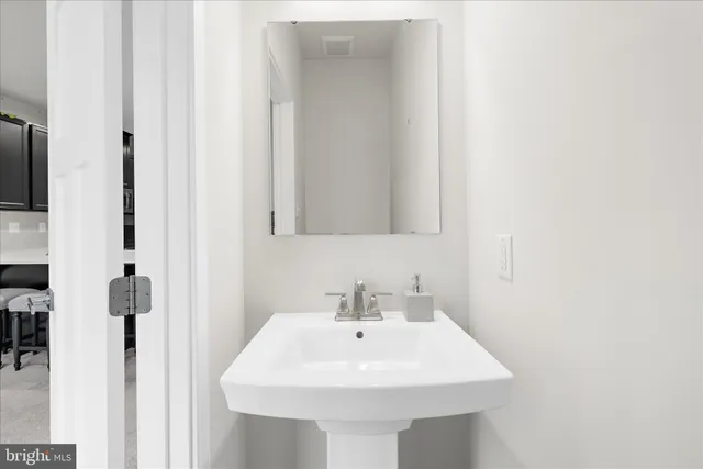 a white sink sitting next to a white sink