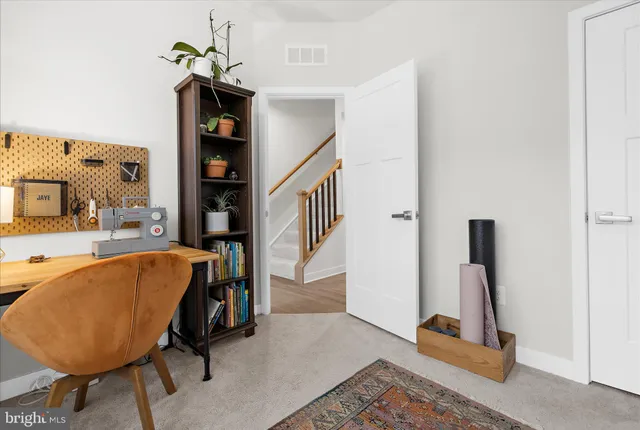 a living room with a couch and a table