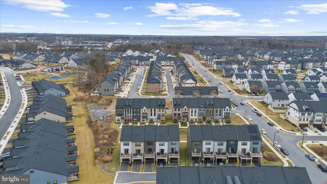 a view of a balcony with couches and wooden floor