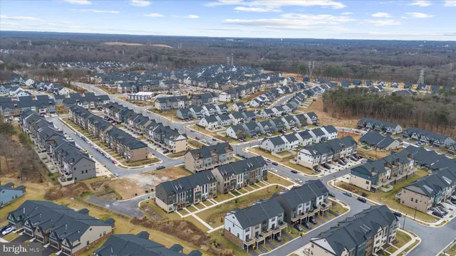 a front view of a residential apartment building with a yard