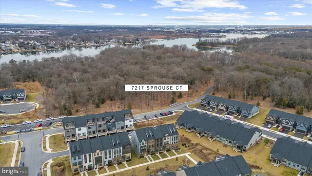 a front view of a residential apartment building with a yard