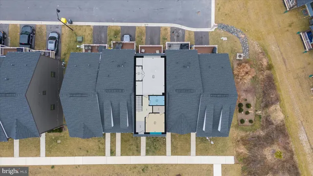 a front view of a residential apartment building with a yard