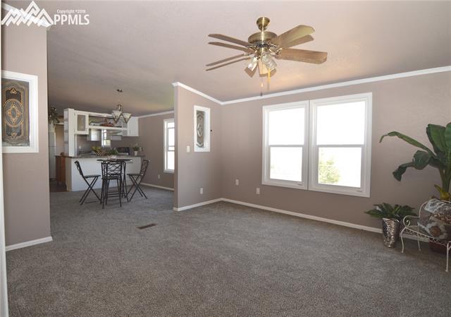 27055 Handle Road Calhan, CO 80808 - Photo 16 of 25 In the family room looking towards the dining room.