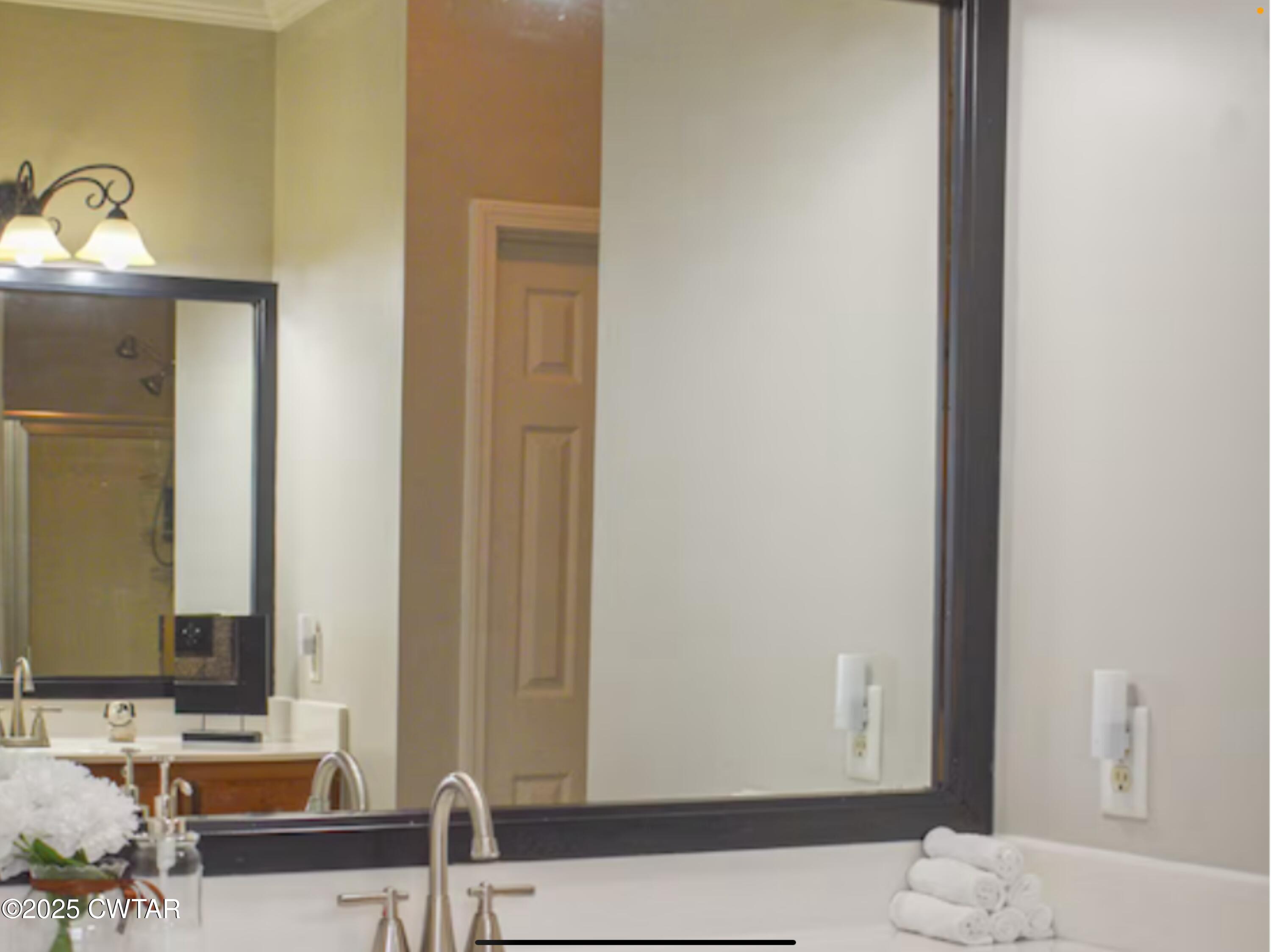 146 Henderson Road Jackson, TN 38305 - Photo 7 of 7 a bathroom with a sink and a mirror