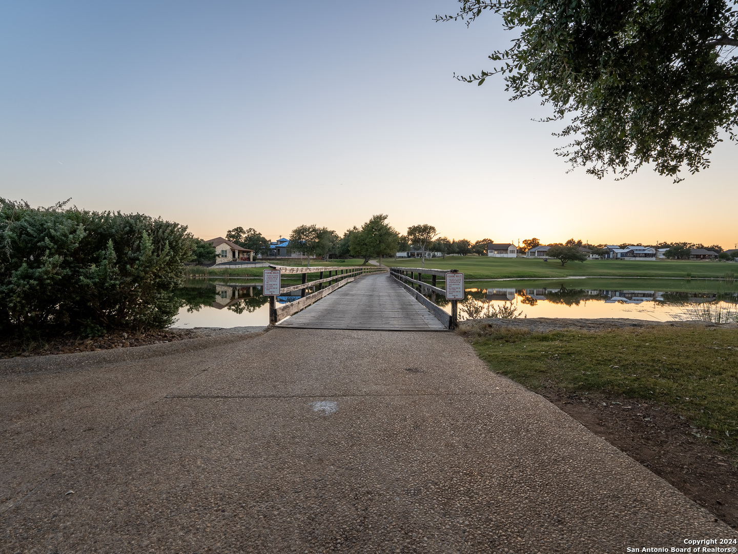 209 North Calvin Barrett Blanco, TX 78606 - Photo 9 of 11 a view of a lake with houses