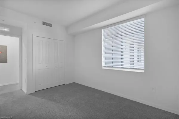 a view of empty room with windows