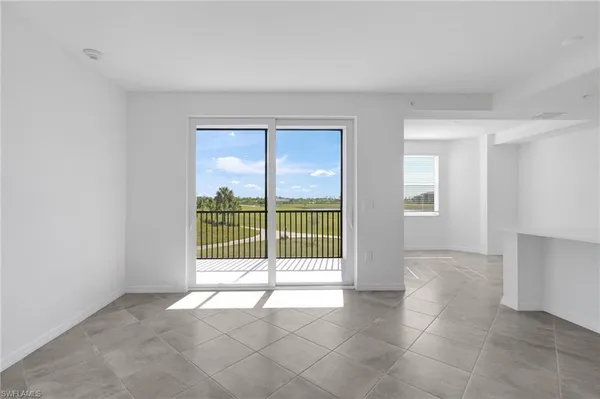 a view of an empty room with glass door