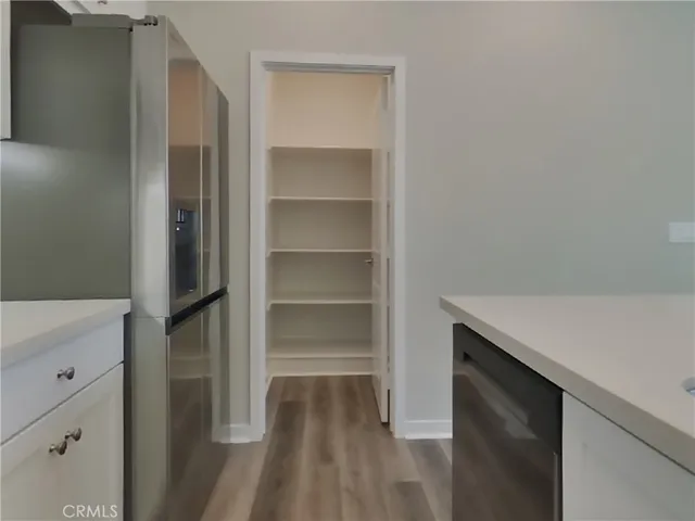 a room with a closet and wooden floor