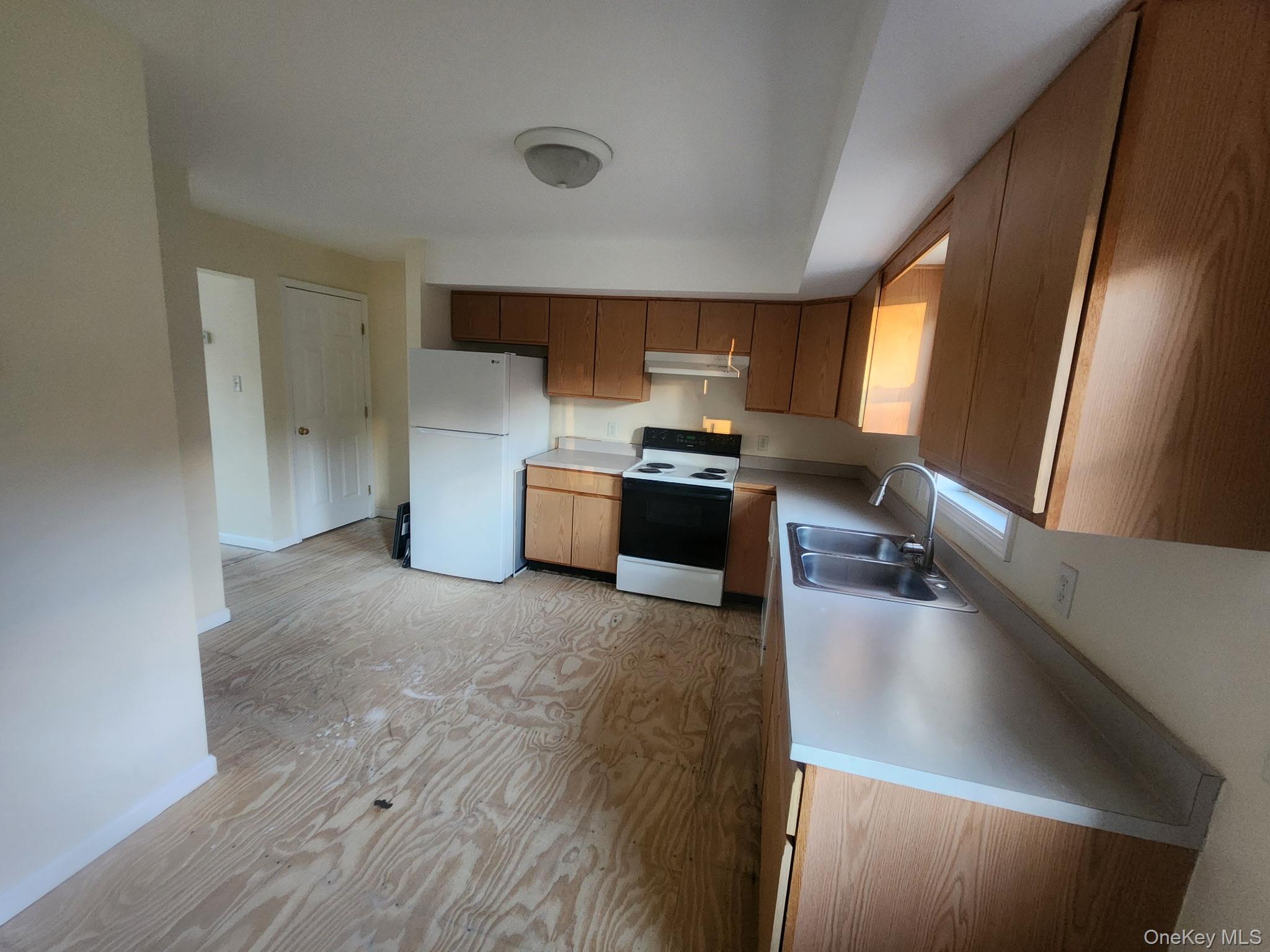 698 South Street, Unit 2 Highland, NY 12528 - Photo 7 of 16 a kitchen with a refrigerator and a sink