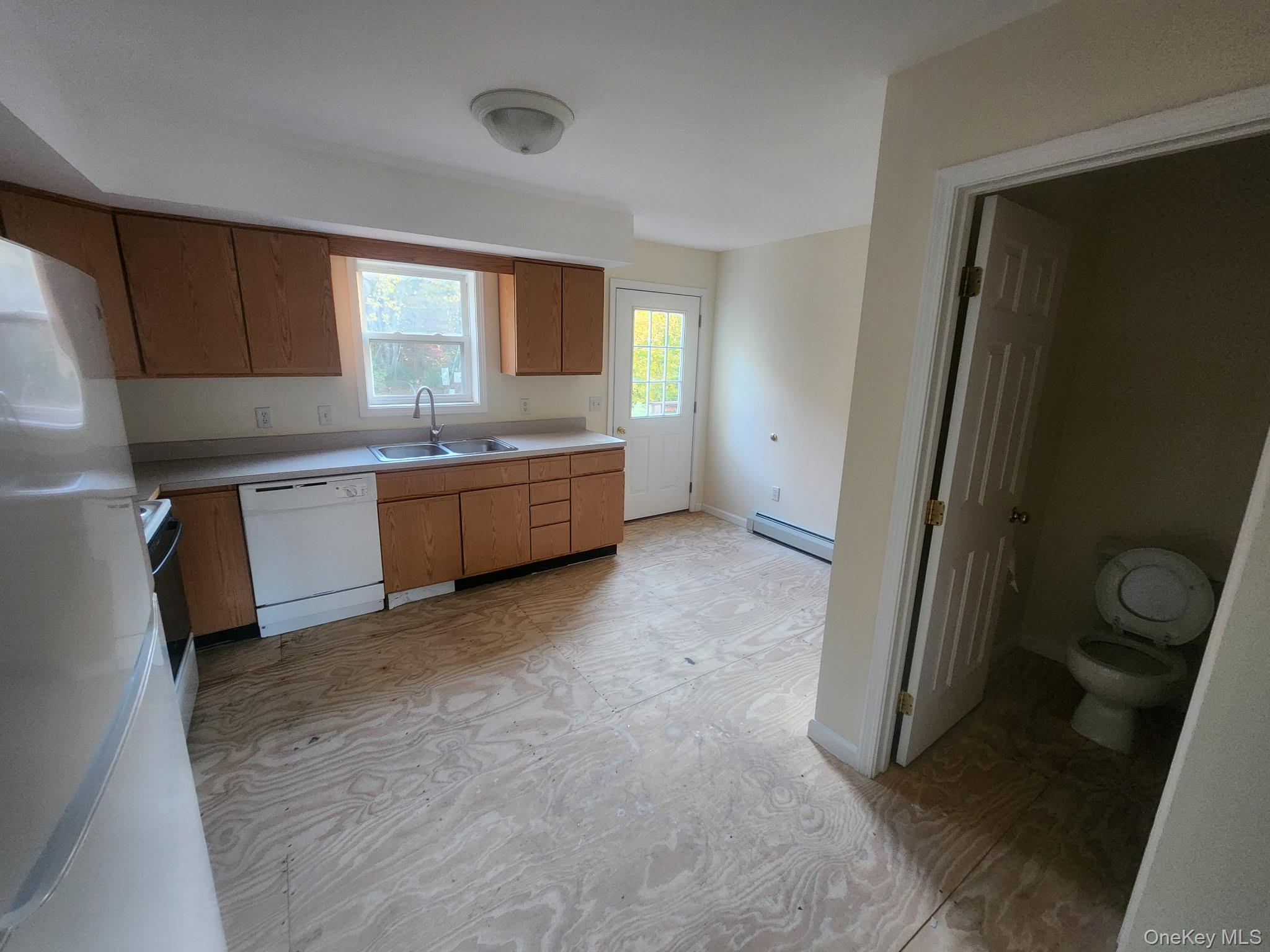 698 South Street, Unit 2 Highland, NY 12528 - Photo 8 of 16 a large kitchen with a sink stove and refrigerator
