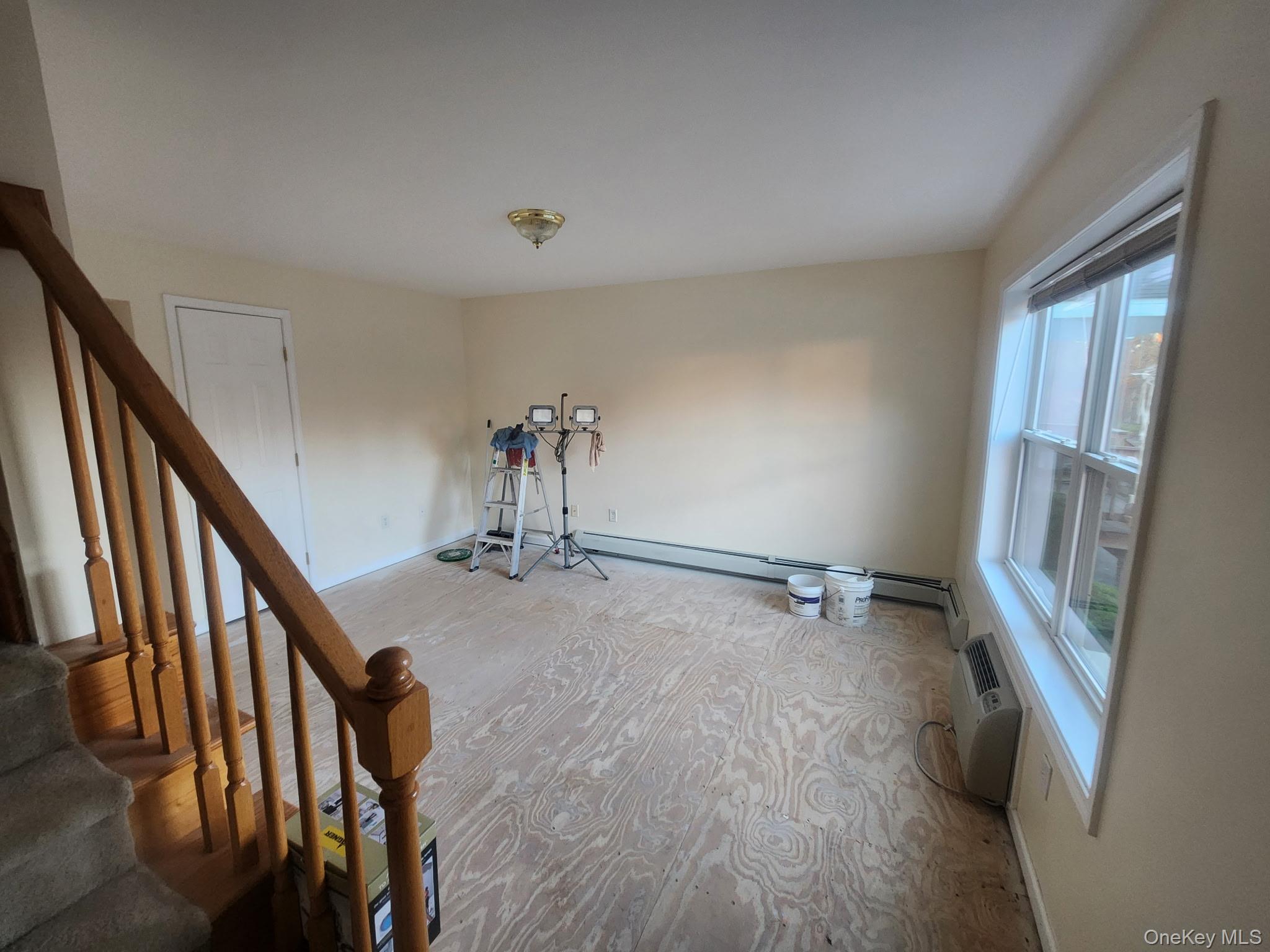 698 South Street, Unit 2 Highland, NY 12528 - Photo 9 of 16 wooden floor in an empty room with a window
