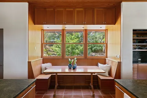 a view of a dining room with furniture window and outside view