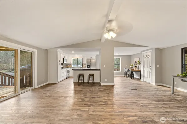 a living room with fireplace furniture and a wooden floor