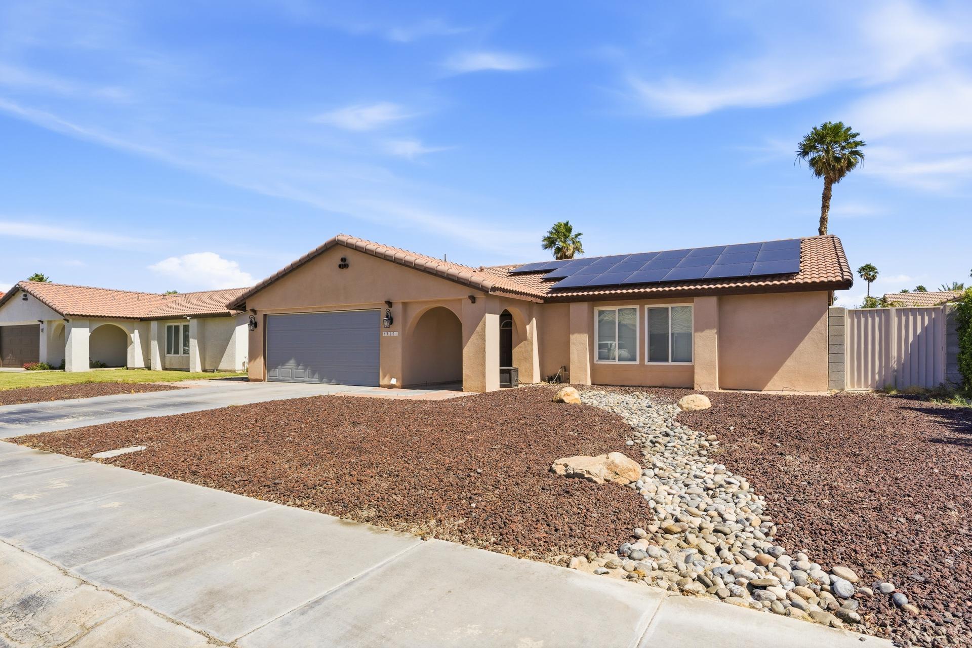 67220 Quijo Road Cathedral City, CA 92234 - Photo 2 of 26 a front view of a house with a yard