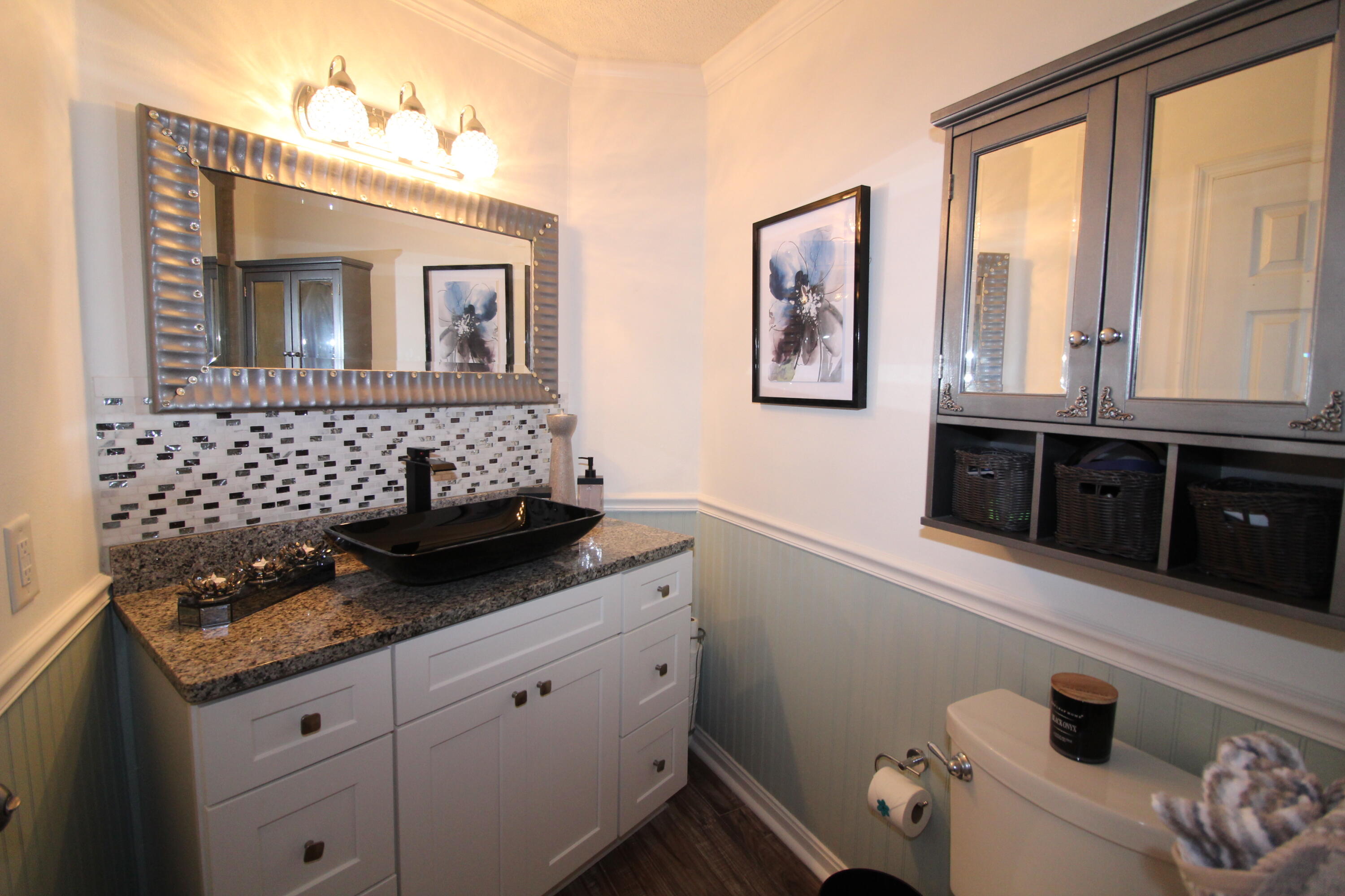 285 Payne Street, Unit 19B Miramar Beach, FL 32550 - Photo 11 of 24 a bathroom with a sink and a mirror