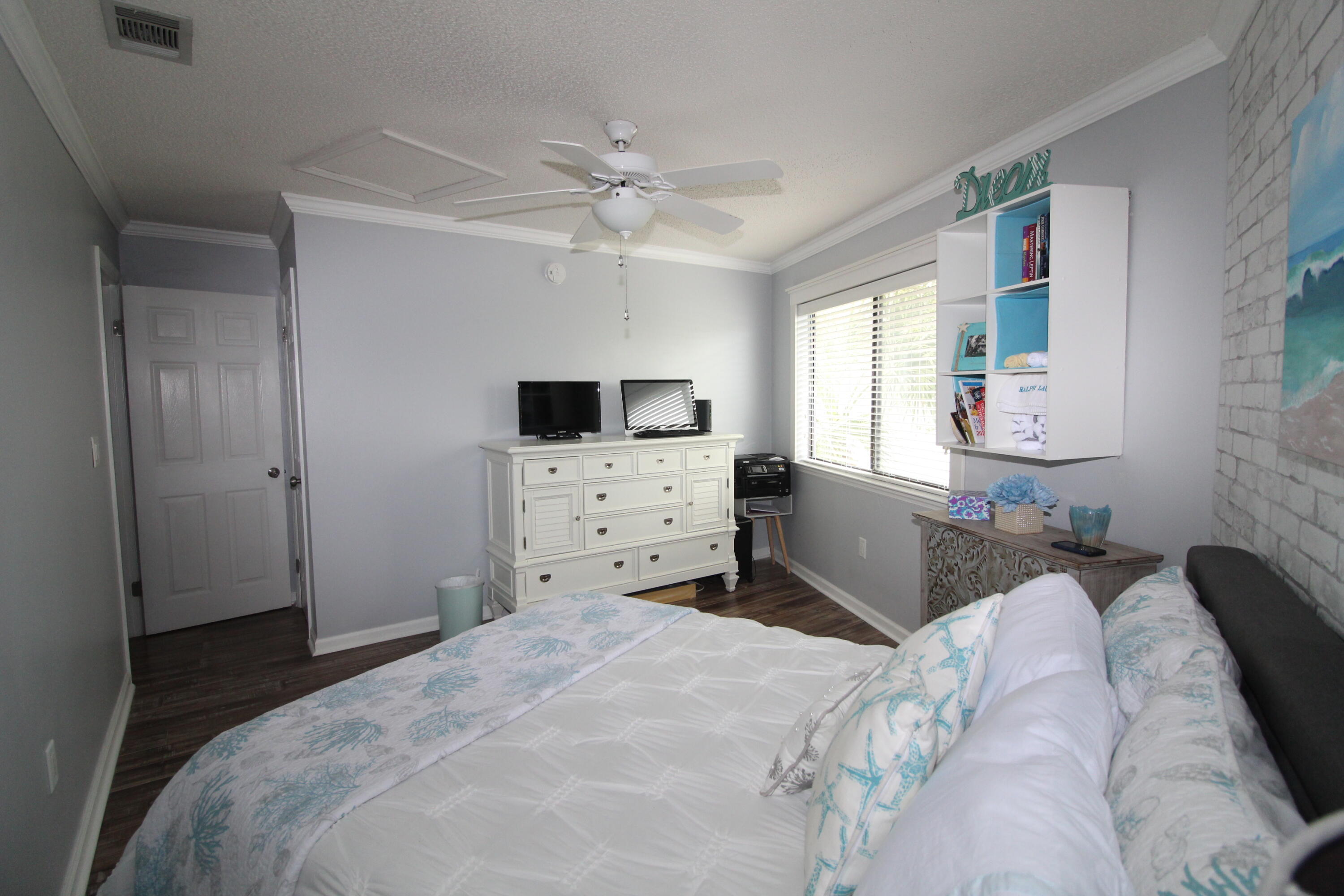 285 Payne Street, Unit 19B Miramar Beach, FL 32550 - Photo 13 of 24 a bedroom with a bed and a tv