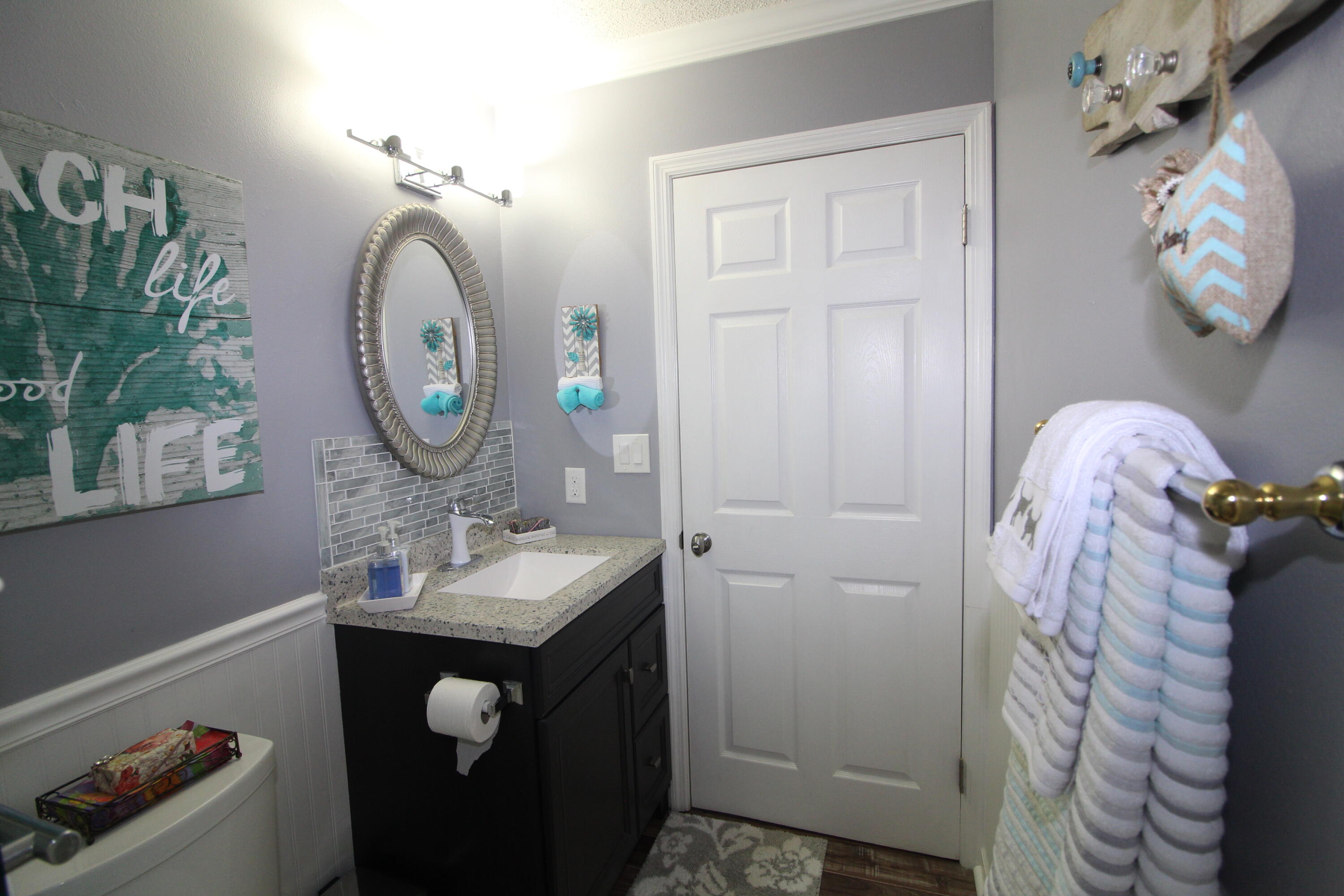 285 Payne Street, Unit 19B Miramar Beach, FL 32550 - Photo 15 of 24 a bathroom with a sink vanity mirror and toilet