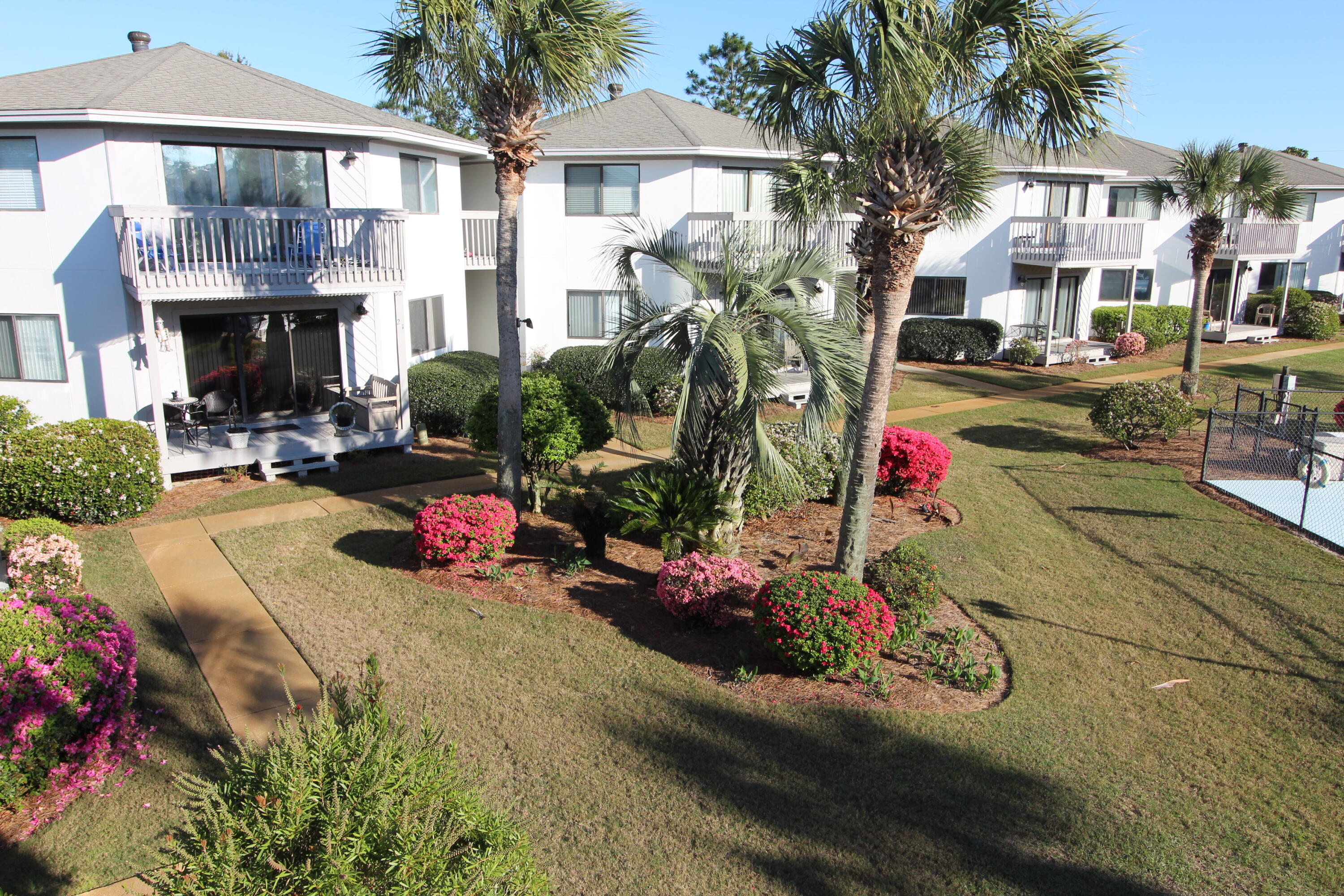 285 Payne Street, Unit 19B Miramar Beach, FL 32550 - Photo 18 of 24 a view of multiple houses with a patio