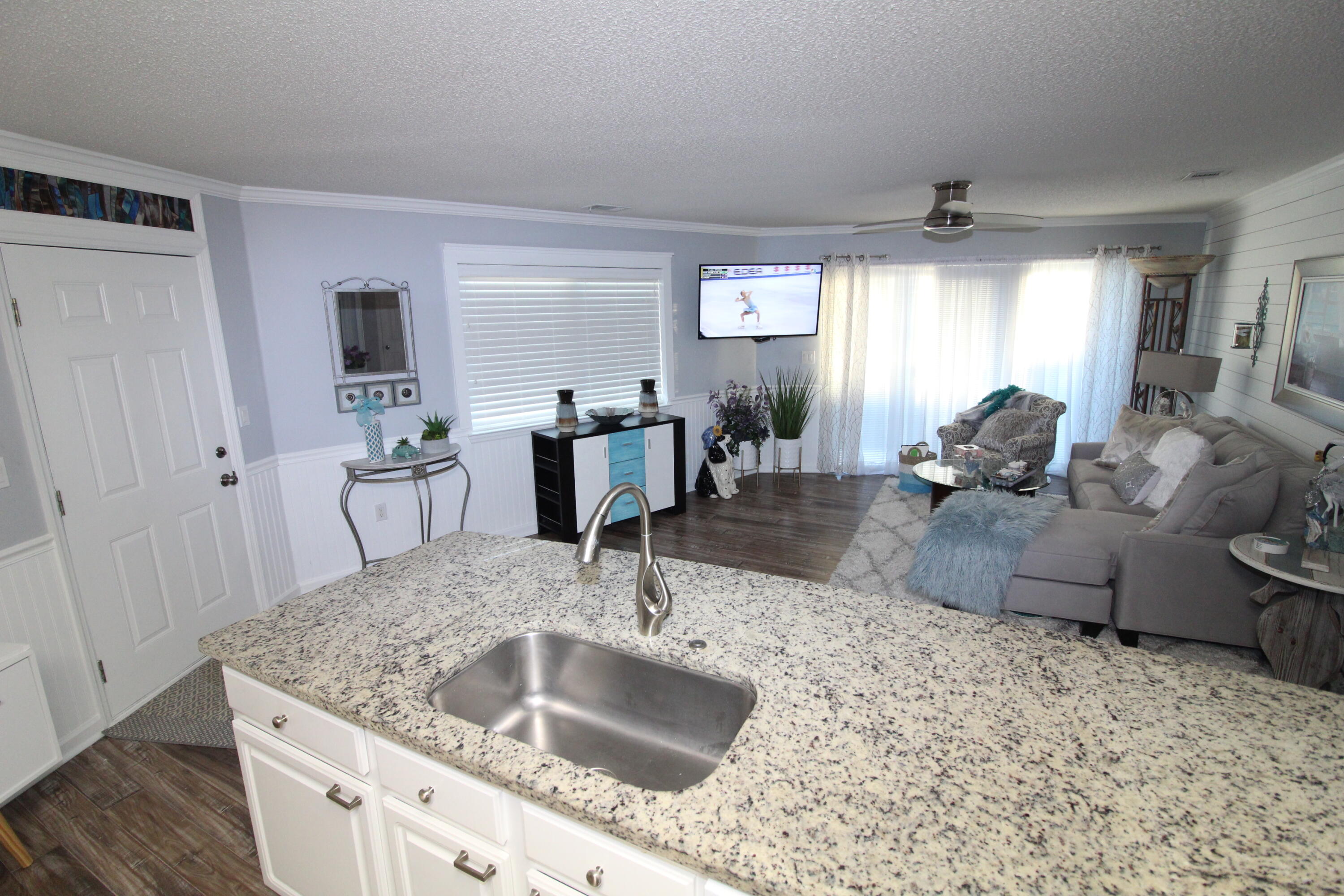 285 Payne Street, Unit 19B Miramar Beach, FL 32550 - Photo 5 of 24 a kitchen with granite countertop a sink and a granite counter tops
