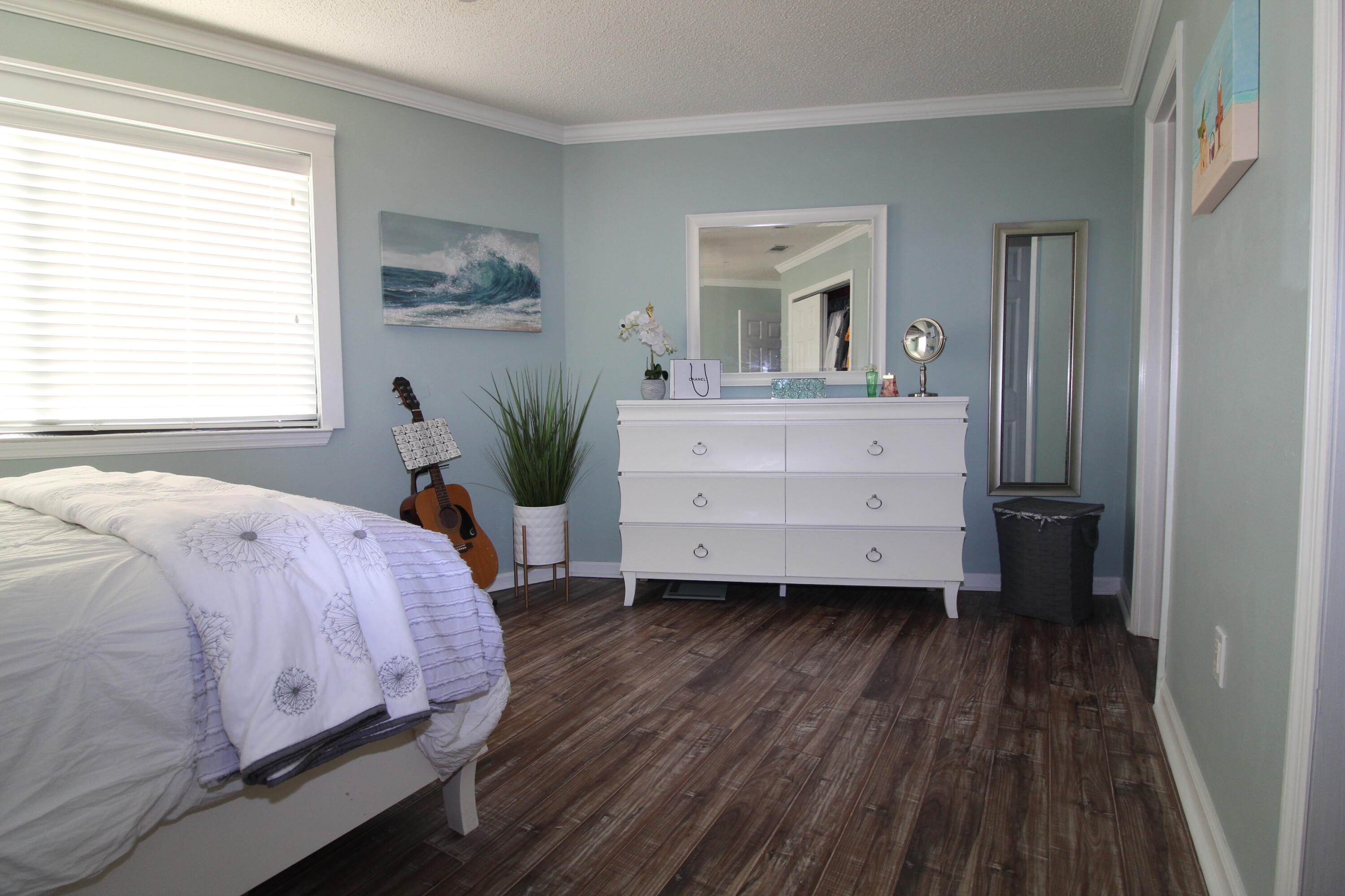 285 Payne Street, Unit 19B Miramar Beach, FL 32550 - Photo 7 of 24 a bed room with a bed and a mirror