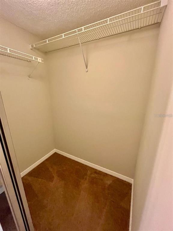 7608 Spring Bay Cove, Unit S Orlando, FL 32819 - Photo 11 of 20 a view of a room with racks on the wall