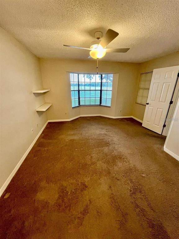 7608 Spring Bay Cove, Unit S Orlando, FL 32819 - Photo 13 of 20 a view of an empty room with a window