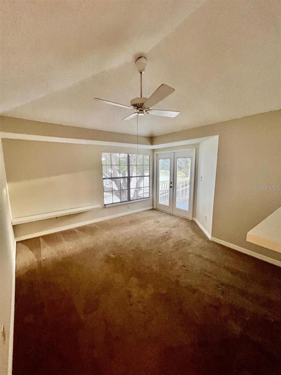 7608 Spring Bay Cove, Unit S Orlando, FL 32819 - Photo 17 of 20 a view of an empty room with a window