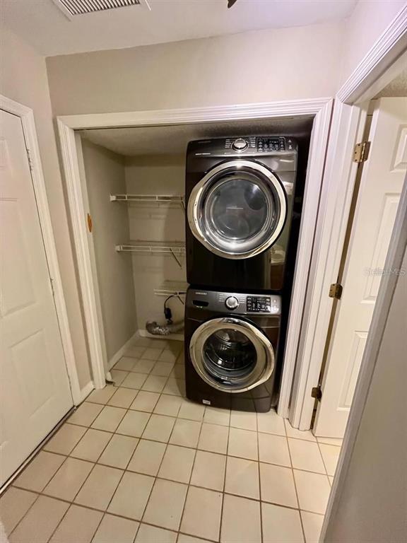 7608 Spring Bay Cove, Unit S Orlando, FL 32819 - Photo 18 of 20 a view of washer and dryer in a utility room