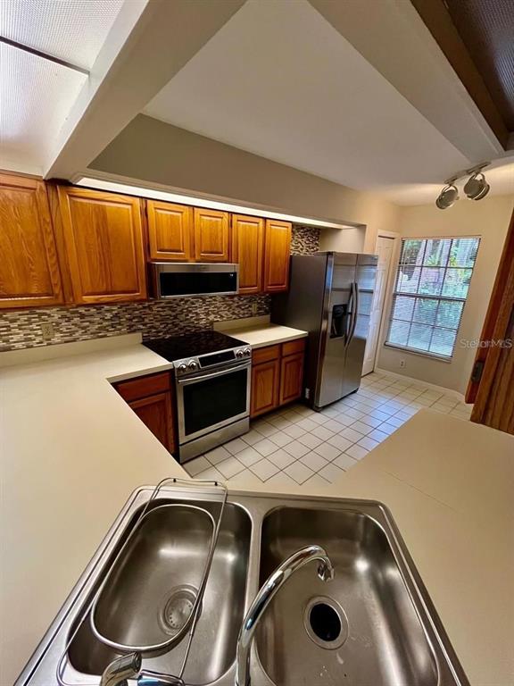 7608 Spring Bay Cove, Unit S Orlando, FL 32819 - Photo 5 of 20 a utility room with washer and dryer