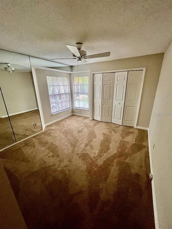 7608 Spring Bay Cove, Unit S Orlando, FL 32819 - Photo 7 of 20 a view of an empty room with a window