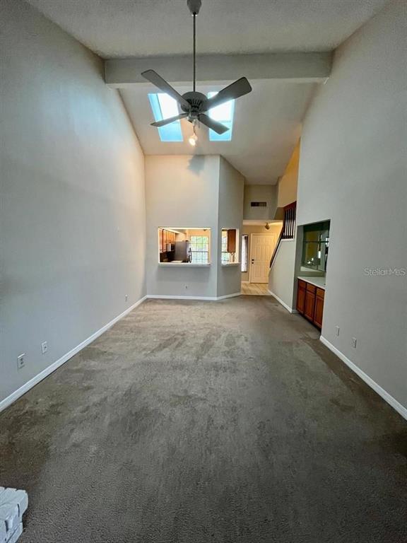 7608 Spring Bay Cove, Unit S Orlando, FL 32819 - Photo 8 of 20 a view of an empty room with a window