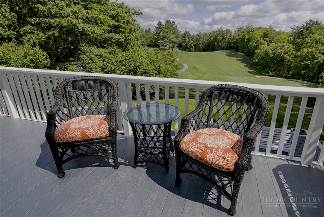 638 Ridge Road Glade Valley, NC 28627 - Photo 8 of 44 a view of a two chairs in the roof deck