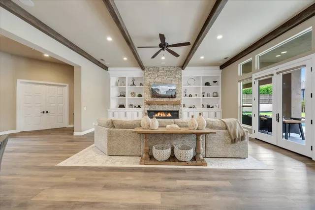 a living room with lots of furniture and kitchen view